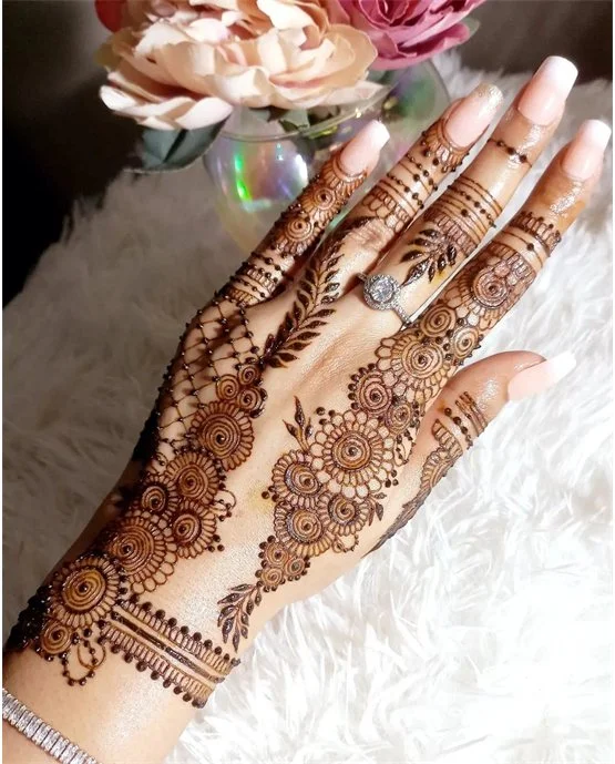 Overlay Bead Accent Blending Into Back Hand Mehndi Design